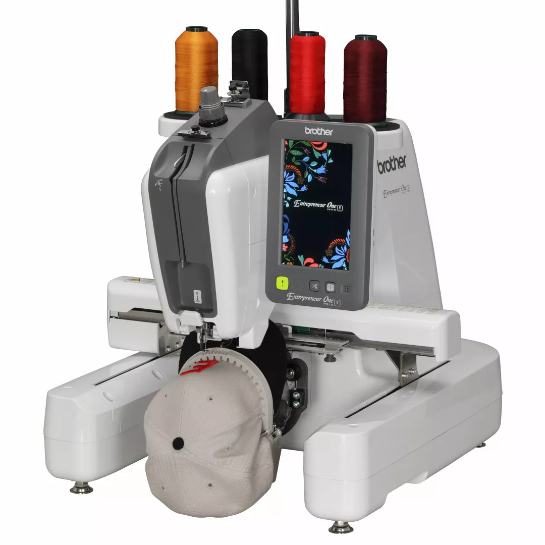 Image of the Brother Entrepreneur One PR1X embroidery machine embroidering on a cap
